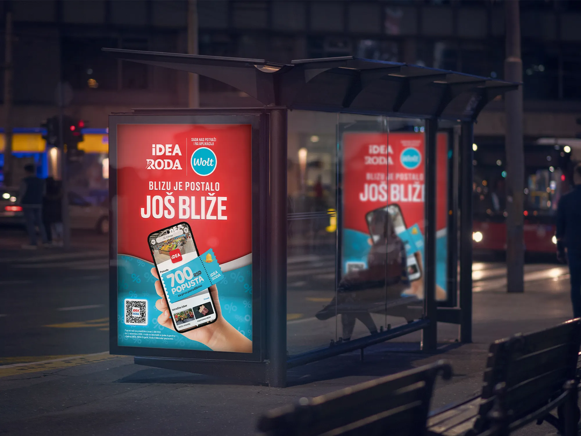 City light na autobuskoj stanici sa reklamom za Wolt dostavu iz IDEA, Roda i Mercator prodavnica: Blizu je postalo još bliže